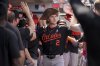 Baltimore Orioles' Gunnar Henderson (2) high-fives teammates in the dugout after hitting a home run during the sixth inning of a baseball game against the Los Angeles Angels, Sunday, May 11, 2025, in Anaheim, Calif. (AP Photo/Eric Thayer)