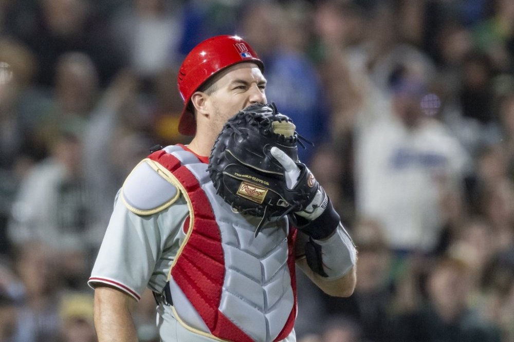 Philadelphia Phillies catcher J.T. Realmuto reacts after attempting to catch a foul ball during the sixth inning of a baseball game against the Athletics Saturday, May 24, 2025, in West Sacramento, Calif. (AP Photo/Sara Nevis)