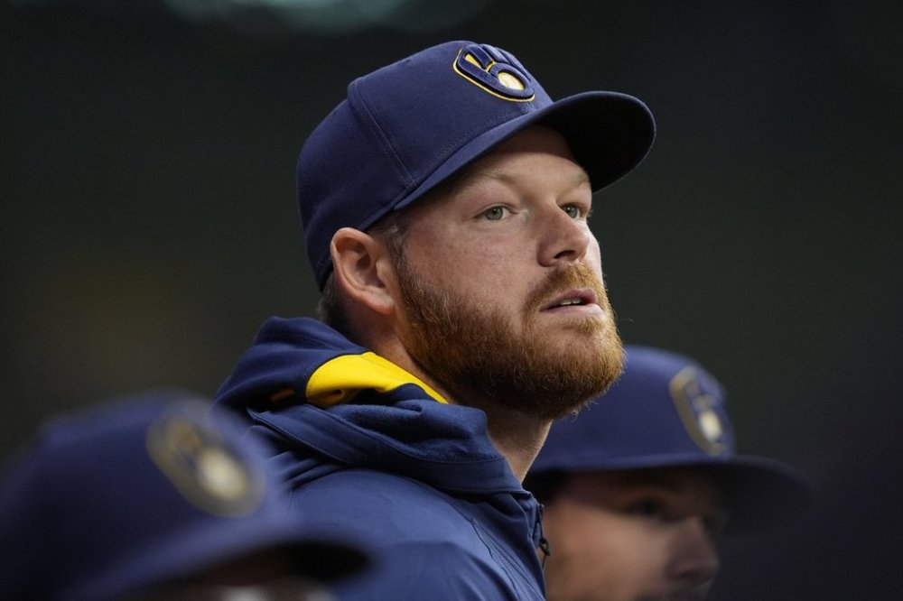 FILE - Milwaukee Brewers' Brandon Woodruff looks on during the eighth inning of a baseball game against the Kansas City Royals, April 1, 2025, in Milwaukee. (AP Photo/Aaron Gash, File)