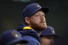 FILE - Milwaukee Brewers' Brandon Woodruff looks on during the eighth inning of a baseball game against the Kansas City Royals, April 1, 2025, in Milwaukee. (AP Photo/Aaron Gash, File)