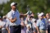 Bryson DeChambeau reacts after hitting his tee shot into the water on the 17th hole during the third round of the PGA Championship golf tournament at the Quail Hollow Club, Saturday, May 17, 2025, in Charlotte, N.C. (AP Photo/George Walker IV)