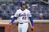 New York Mets' Juan Soto (22) reacts after striking out during the fifth inning of a baseball game against the Chicago White Sox Wednesday, May 28, 2025, in New York. (AP Photo/Frank Franklin II)