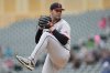 Cleveland Guardians starting starting pitcher Gavin Williams (32) winds up to deliver during the first inning in the second baseball game of a doubleheader against the Minnesota Twins, Wednesday, May 21, 2025, in Minneapolis. (AP Photo/Abbie Parr)