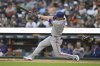 Texas Rangers' Corey Seager hits an RBI double against the Detroit Tigers during the fifth inning of a baseball game Saturday, May 10, 2025, in Detroit. (AP Photo/Lon Horwedel)