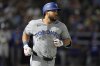 Toronto Blue Jays' Anthony Santander runs to first base after his single off Tampa Bay Rays pitcher Garrett Cleavinger during the sixth inning of a baseball game Saturday, May 24, 2025, in Tampa, Fla. (AP Photo/Chris O'Meara)