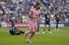 Inter Miami forward Lionel Messi, foreground, celebrates after scoring during the second half of an MLS soccer match against Minnesota United, Saturday, May 10, 2025, in St. Paul, Minn. (AP Photo/Abbie Parr)