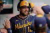 Milwaukee Brewers' Rhys Hoskins is congratulated in the dugout after hitting a home run in the seventh inning of a baseball game against the Cleveland Guardians in Cleveland, Wednesday, May 14, 2025. (AP Photo/Sue Ogrocki)