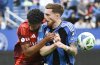 Toronto FC's Kosi Thompson, left, challenges CF Montreal's Joel Waterman (16) during first-half MLS soccer action in Montreal, Saturday, May 17, 2025. THE CANADIAN PRESS/Graham Hughes