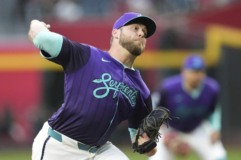 Arizona Diamondbacks starting pitcher Corbin Burnes throws against the Colorado Rockies during the first inning of a baseball game Friday, May 16, 2025, in Phoenix. (AP Photo/Ross D. Franklin)
