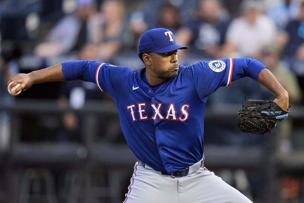 Texas Rangers pitcher Kumar Rocker delivers to the Tampa Bay Rays during the first inning of a baseball game Wednesday, June 4, 2025, in Tampa, Fla. (AP Photo/Chris O'Meara)