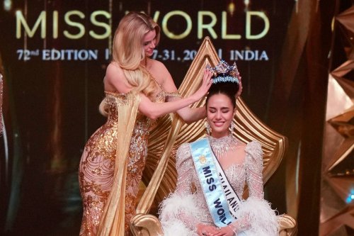 Krystyna Pyszkova of Czech Republic, left, crowns her successor Opal Suchata of Thailand after she who won the 72nd Miss World pageant in Hyderabad, India, Saturday, May 31, 2025. (AP Photo/Mahesh Kumar A.)