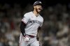 Minnesota Twins' Carlos Correa celebrates after hitting a go-ahead two-run home run during the 10th inning of a baseball game against the Seattle Mariners Friday, May 30, 2025, in Seattle. DaShawn Keirsey Jr. also scored. (AP Photo/Ryan Sun)