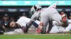 Detroit Tigers' Riley Greene slides safely into home plate ahead of the tag of Boston Red Sox catcher Carlos Narváez in the second inning during a baseball game, Wednesday, May 14, 2025, in Detroit. (AP Photo/Paul Sancya)