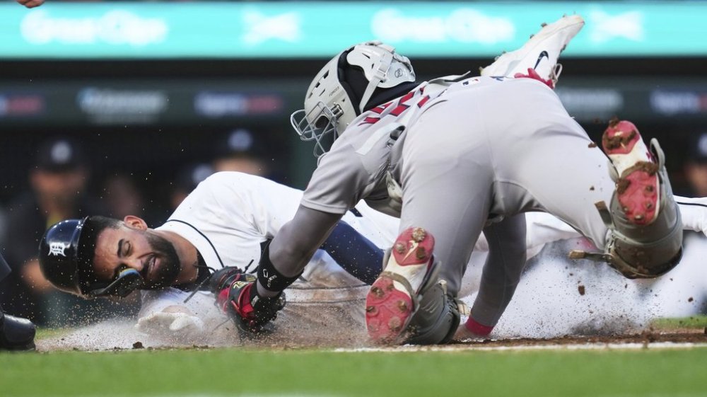 Detroit Tigers' Riley Greene slides safely into home plate ahead of the tag of Boston Red Sox catcher Carlos Narváez in the second inning during a baseball game, Wednesday, May 14, 2025, in Detroit. (AP Photo/Paul Sancya)