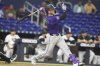 Colorado Rockies' Hunter Goodman follows through on a solo home run during the fifth inning of a baseball game against the Miami Marlins, Monday, June 2, 2025, in Miami. (AP Photo/Lynne Sladky)