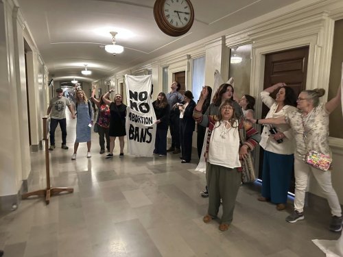 People in support of abortion rights protest outside the Missouri Senate chamber after the Senate voted to approve a referendum seeking to repeal an abortion-rights amendment on Wednesday, May 14, 2025, in Jefferson City, Mo. (AP Photo/David A. Lieb)