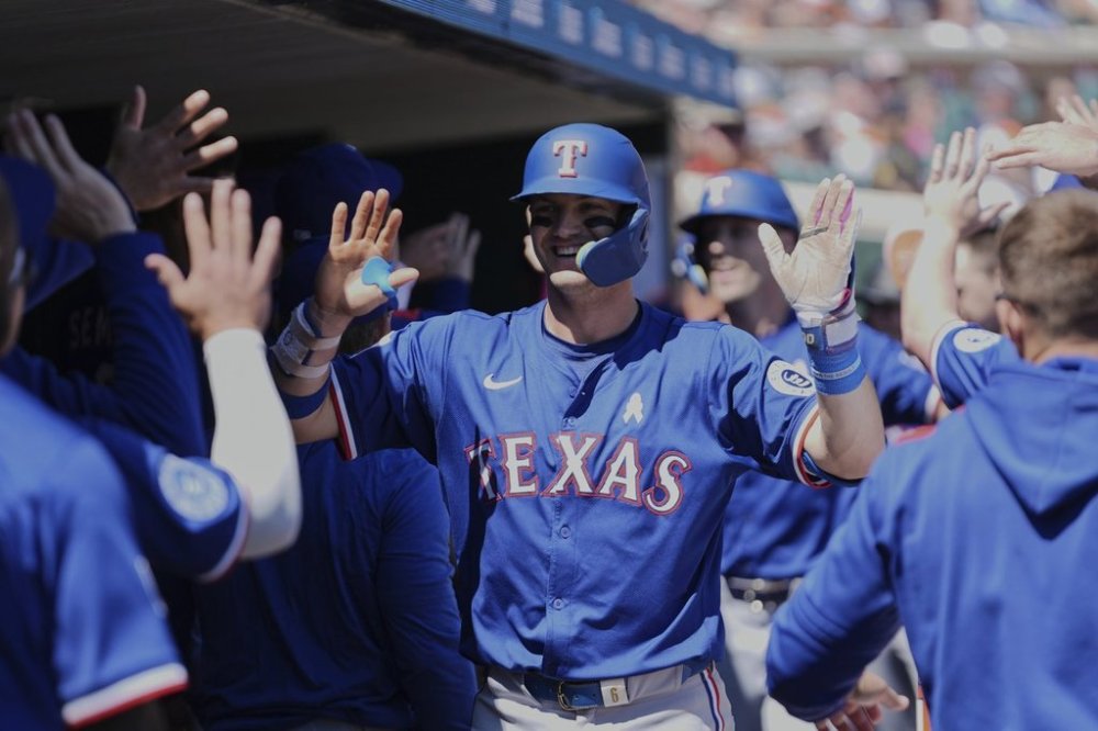 Texas Rangers' Josh Jung celebrates his two-run home run against the Detroit Tigers in the fifth inning during a baseball game, Sunday, May 11, 2025, in Detroit. (AP Photo/Paul Sancya)