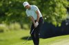 Jordan Spieth chips to the green on the 12th hole during the first round of the PGA Championship golf tournament at the Quail Hollow Club, Thursday, May 15, 2025, in Charlotte, N.C. (AP Photo/Matt York)