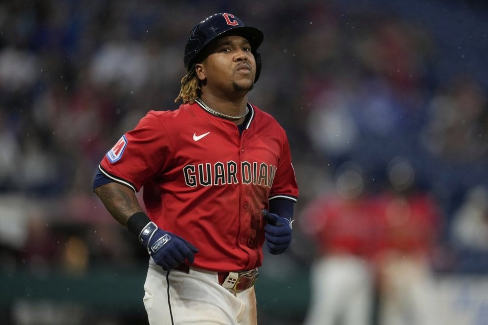 Cleveland Guardians' Jose Ramirez trots to first base with an intentional walk in the seventh inning of a baseball game against the Milwaukee Brewers in Cleveland, Monday, May 12, 2025. (AP Photo/Sue Ogrocki)