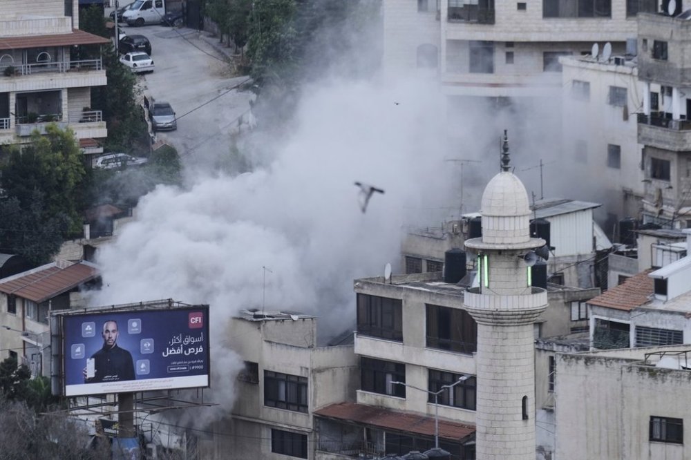 Smoke rises as the Israeli forces demolish the home of Jaafar Mona, a Palestinian militant who died when the bomb he was carrying in Tel Aviv exploded, apparently prematurely, last August. In the West Bank City of Nablus on Thursday, May 29, 2025. (AP Photo/Majdi Mohammed)