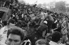 FILE - A crowd of soccer fans in the Brussels Heysel stadium, falls down in a heavy group over the broken fence just prior to the European Champion's Cup Final between Liverpool and Juventus of Turin, in Brussels, Belgium, May 29, 1985. (AP Photo/Gianni Foggia, File)
