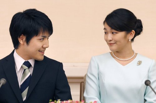 FILE - Japan's Princess Mako and her fiance Kei Komuro look at each other during a press conference at Akasaka East Residence in Tokyo, on Sept. 3, 2017. (AP Photo/Shizuo Kambayashi, Pool, File)