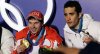 FILE - Russia's gold medal winner Evgeny Ustyugov, left, and France's silver medal winner Martin Fourcade, pose for photos during their medal ceremony for the Men's 15k mass start Biathlon race at the Vancouver 2010 Olympics in Whistler, British Columbia, Canada, Feb. 21, 2010. (AP Photo/Dmitry Lovetsky, File)