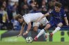 Djurgarden's Daniel Stensson, left, duels for the ball with Chelsea's Reggie Walsh during the Europa Conference League semifinal second leg soccer match between Chelsea and Djurgarden, at Stamford Bridge stadium in London, Thursday, May 8, 2025. (AP Photo/Ian Walton)