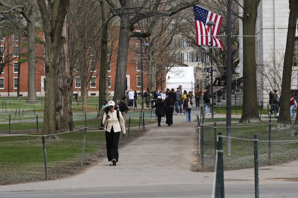 Pedestrians walk through Harvard Yard at Harvard University, April 15 in Cambridge, Mass. THE CANADIAN PRESS/AP-Charles Krupa