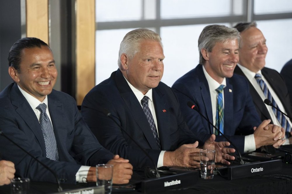 Ontario Premier Doug Ford, second from left, speaks to reporters with, from left to right, Manitoba Premier Wab Kinew, Nova Scotia Premier Tim Houston, and Quebec Premier Francois Legault as Canada's premiers hold a press conference to close the Council of the Federation meetings in Halifax on Wednesday, July 17, 2024. THE CANADIAN PRESS/Darren Calabrese