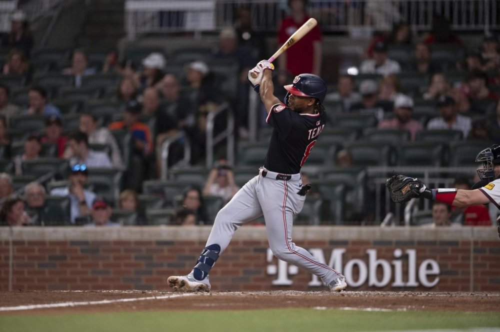 Washington Nationals' José Tena (8) gets a base hit in the seventh inning of a baseball game against the Atlanta Braves Wednesday, May 14, 2025 in Atlanta. (AP Photo/Kathryn Skeean)