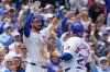 Chicago Cubs' Dansby Swanson, left, and Moisés Ballesteros (25) celebrate after scoring against the Chicago White Sox during the second inning of a baseball game Saturday, May 17, 2025, in Chicago. (AP Photo/David Banks)