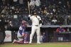 New York Yankees' Jasson Domínguez reacts after hitting a home run during the ninth inning of a baseball game against the Texas Rangers, Wednesday, May 21, 2025, in New York. (AP Photo/Pamela Smith)