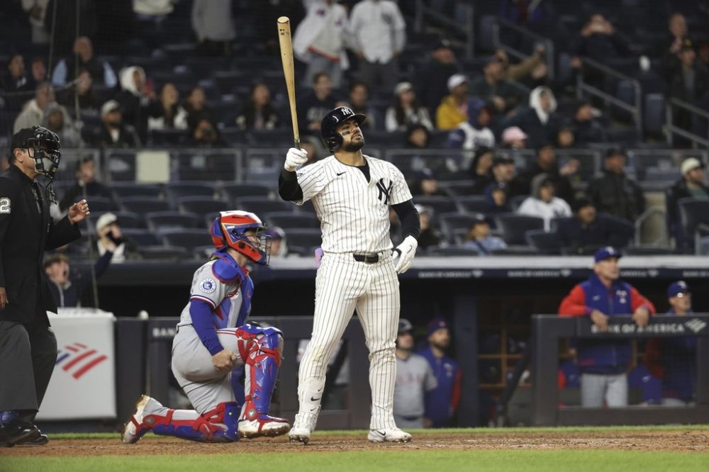 New York Yankees' Jasson Domínguez reacts after hitting a home run during the ninth inning of a baseball game against the Texas Rangers, Wednesday, May 21, 2025, in New York. (AP Photo/Pamela Smith)