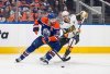 Vegas Golden Knights' Jack Eichel (9) and Edmonton Oilers' Leon Draisaitl (29) battle for the puck during first period round 2, game 4 NHL Stanley Cup playoff action in Edmonton, Monday, May 12, 2025. THE CANADIAN PRESS/Jason Franson