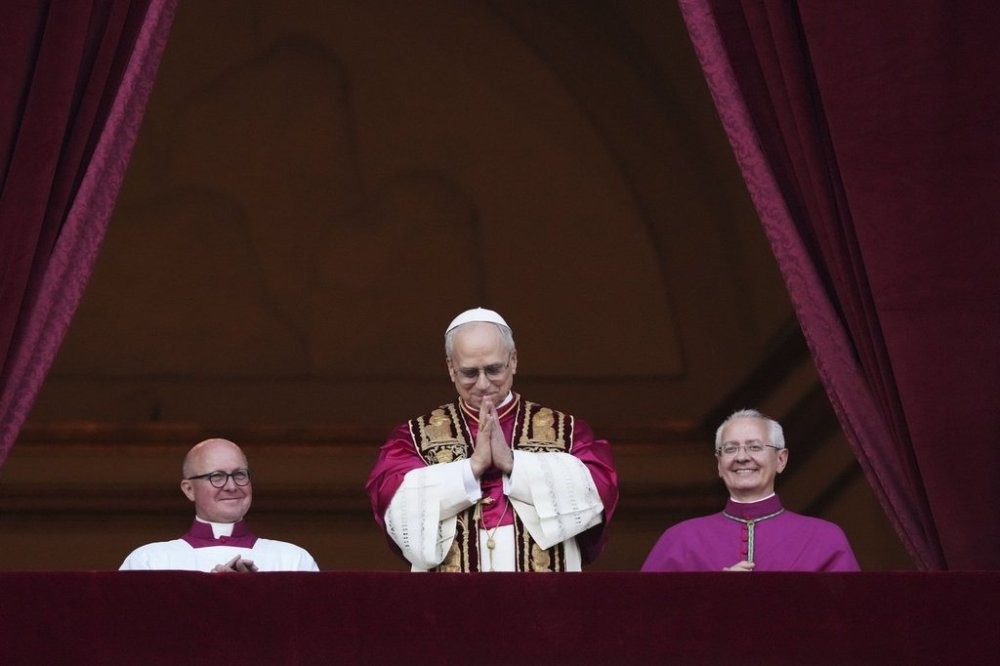 Newly elected Pope Leo XIV appears at the balcony of St. Peter's Basilica at the Vatican, Thursday, May 8, 2025. (AP Photo/Alessandra Tarantino)