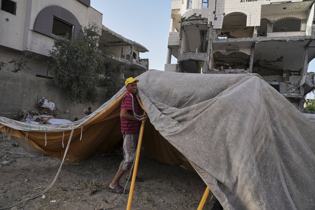 After brief return home, a family in Gaza is forced by war to flee ...