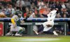 Houston Astros' Christian Walker (8) scores a run on Cam Smith's RBI single against Athletics starting pitcher Luis Severino during the fourth inning of a baseball game, Wednesday, May 28, 2025, in Houston. (AP Photo/Karen Warren)