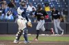 Miami Marlins' Otto Lopez scores in front of Tampa Bay Rays catcher Danny Jansen on an RBI single by Heriberto Hernandez off pitcher Garrett Cleavinger during the 10th inning of a baseball game Saturday, June 7, 2025, in Tampa, Fla. (AP Photo/Chris O'Meara)