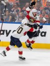 Florida Panthers winger Brad Marchand (63) celebrates his game-winning goal against the Oilers with Jesper Boqvist (70) during the second overtime period in Game 2 of the Stanley Cup final in Edmonton on Friday, June 6, 2025. THE CANADIAN PRESS/Jason Franson