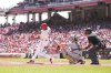 Cincinnati Reds' Will Benson hits a single during the second inning of a baseball game against the Cleveland Guardians, Sunday, May 18, 2025, in Cincinnati. (AP Photo/Jeff Dean)