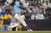 Milwaukee Brewers' Isaac Collins hits an RBI single during the eighth inning of a baseball game against the San Diego Padres, Saturday, June 7, 2025, in Milwaukee. (AP Photo/Aaron Gash)