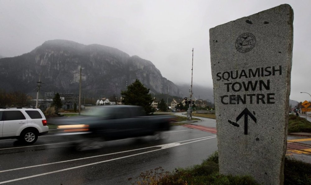 Vehicles drive out of the town centre in Squamish, B.C., on Wednesday, Nov. 18, 2009. THE CANADIAN PRESS/Darryl Dyck