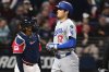 Los Angeles Dodgers' Shohei Ohtani scores a run on a three-run home run by Max Muncy during the ninth inning of a baseball game against the Cleveland Guardians, Tuesday, May 27, 2025, in Cleveland. (AP Photo/David Dermer)