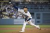 Los Angeles Dodgers starting pitcher Yoshinobu Yamamoto delivers a pitch during the first inning of a baseball game against the Arizona Diamondbacks in Los Angeles, Tuesday, May 20, 2025. (AP Photo/Kyusung Gong)