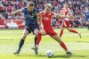 Heidenheim's Patrick Mainka, left, and Berlin's Benedict Hollerbach, right, challenge for the ball during the German Bundesliga soccer match between 1. FC Union Berlin and FC Heidenheim in Berlin, Germany, Saturday, May 10, 2025. (Andreas Gora/dpa via AP)