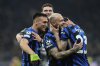 Inter Milan players celebrate at the end of the Champions League semifinal second leg soccer match between Inter Milan and Barcelona at San Siro stadium in Milan , Italy, Tuesday, May 6, 2025. (AP Photo/Luca Bruno)