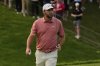 Scottie Scheffler gestures after his putt on the 18th green during the third round of the Memorial golf tournament Saturday, May 31, 2025, in Dublin, Ohio. (AP Photo/Sue Ogrocki)