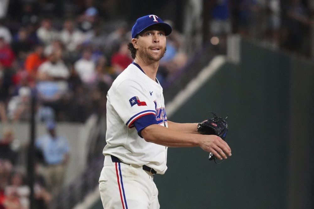 Texas Rangers starting pitcher Jacob deGrom watches a hit ball go foul during the seventh inning of a baseball game against the Houston Astros, Thursday, May 15, 2025, in Arlington, Texas. (AP Photo/LM Otero)