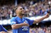 Rangers' Cyriel Dessers celebrates scoring their side's first goal of the game during the Scottish Premiership soccer match between Rangers and Celtic at Ibrox Stadium, Glasgow, Scotland, Sunday, May 4, 2025. (Steve Welsh/PA via AP)